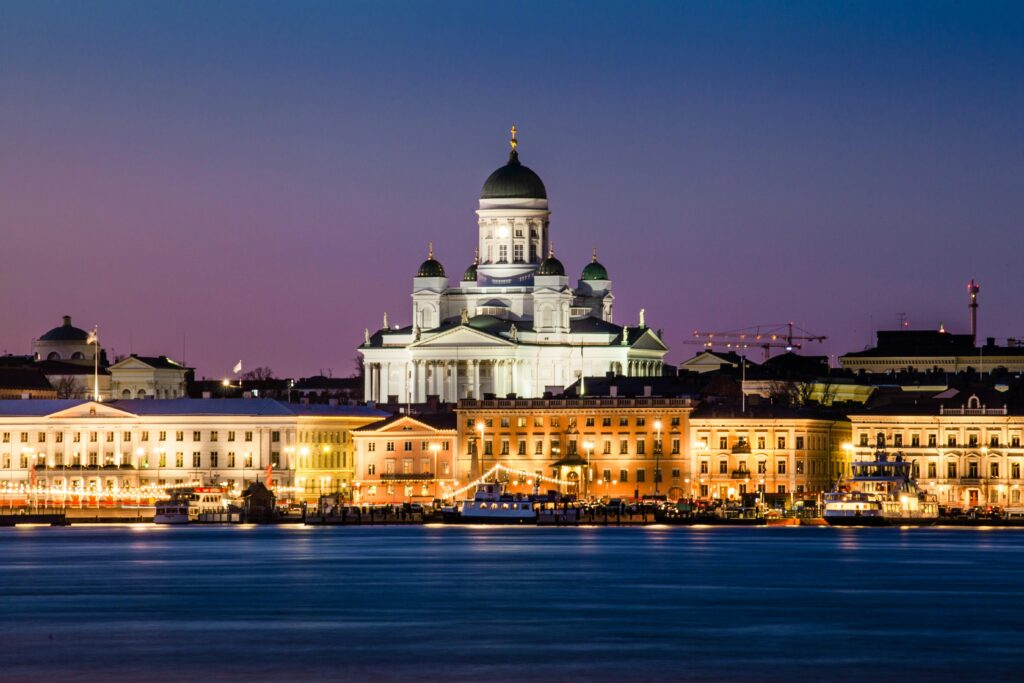 pexels-photo-2311602-2311602 A stunning view of Helsinki Cathedral glowing at dusk with reflections on the water.
