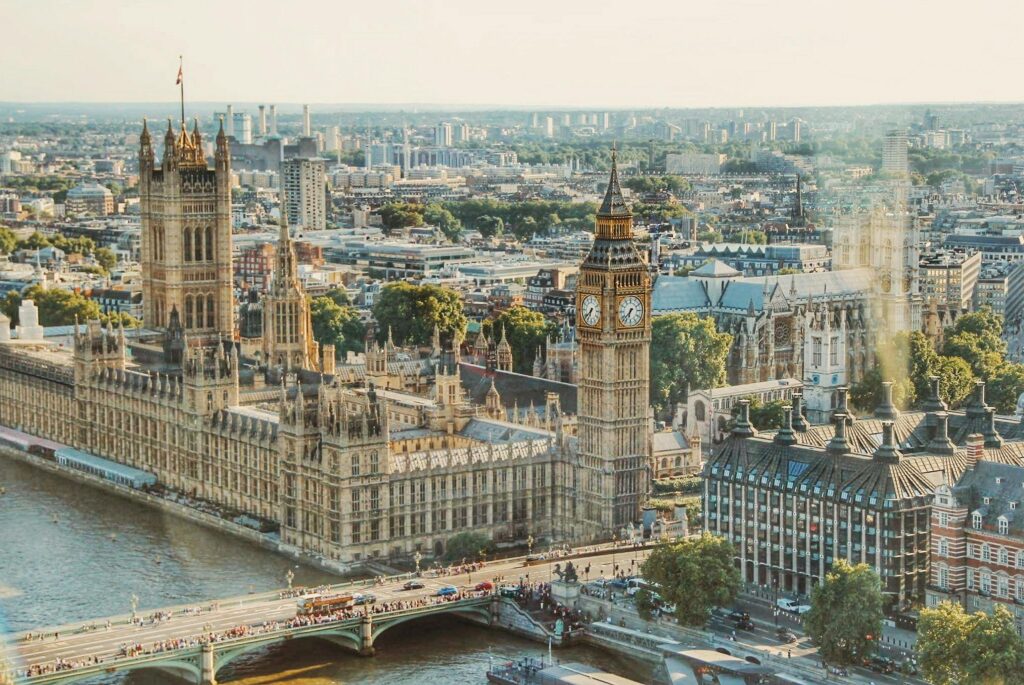 pexels-photo-672532-672532 Stunning aerial view of London's iconic Big Ben and the river Thames under daylight.